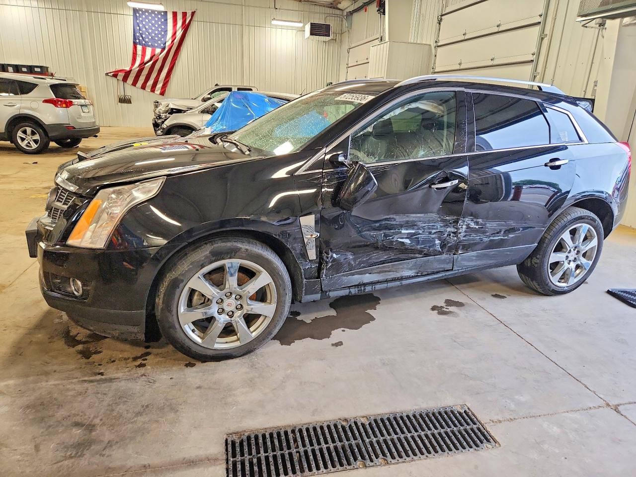 2012 Cadillac SRX Performance Collection, VIN 3GYFNBE32CS581597 — Side