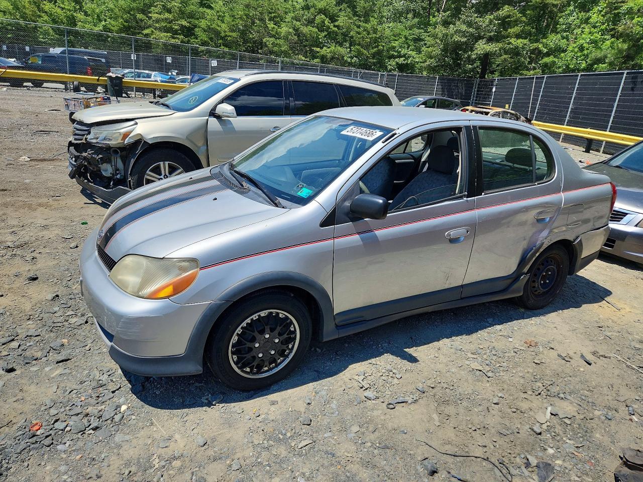 2001 Toyota ECHO, VIN JTDBT123910154012 — Зад