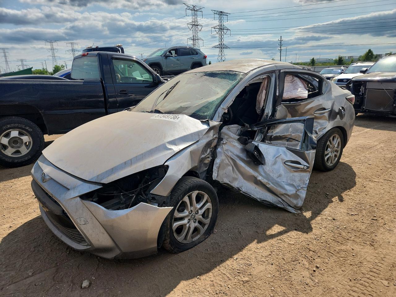 2016 Scion iA, VIN 3MYDLBZV7GY125629 — Side