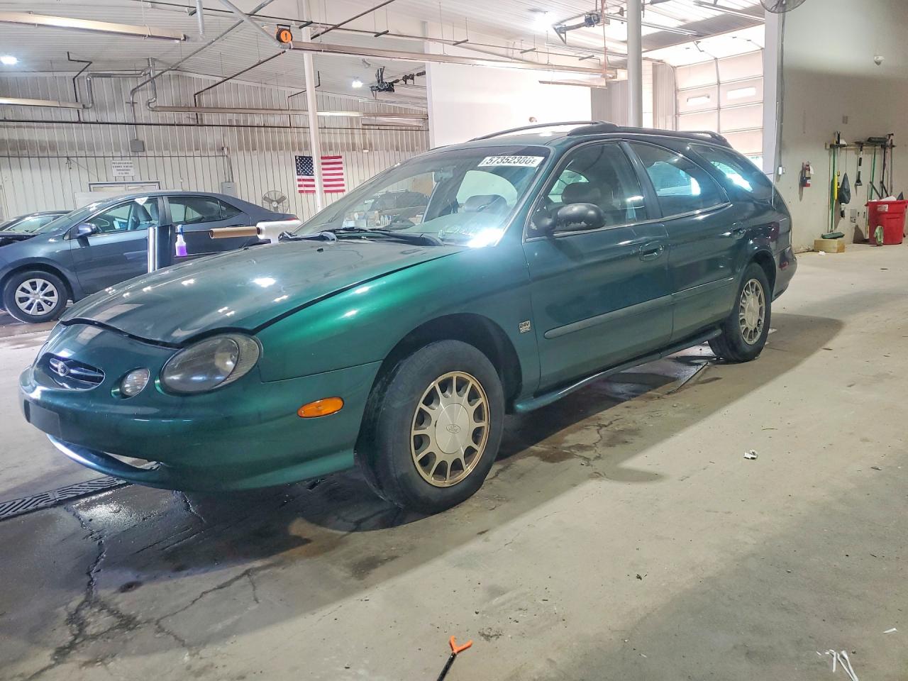 1999 Ford Taurus SE, VIN 1FAFP58S4XA180649 — Side