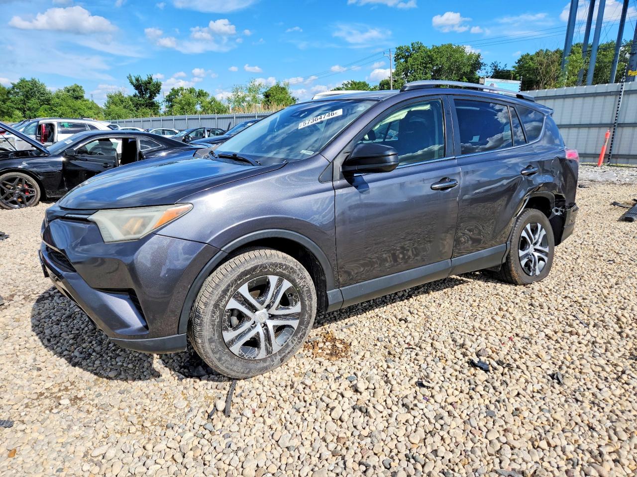 2018 Toyota RAV4 LE, VIN JTMZFREV3JJ185574 — Side