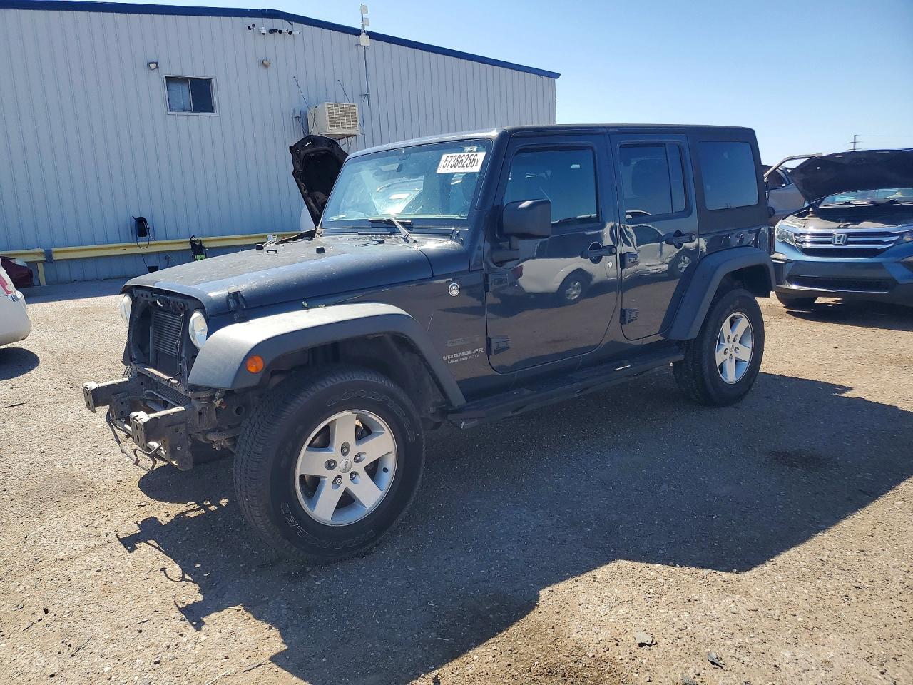2017 Jeep Wrangler Unlimited Sport, VIN 1C4BJWDGXHL636337 — Side