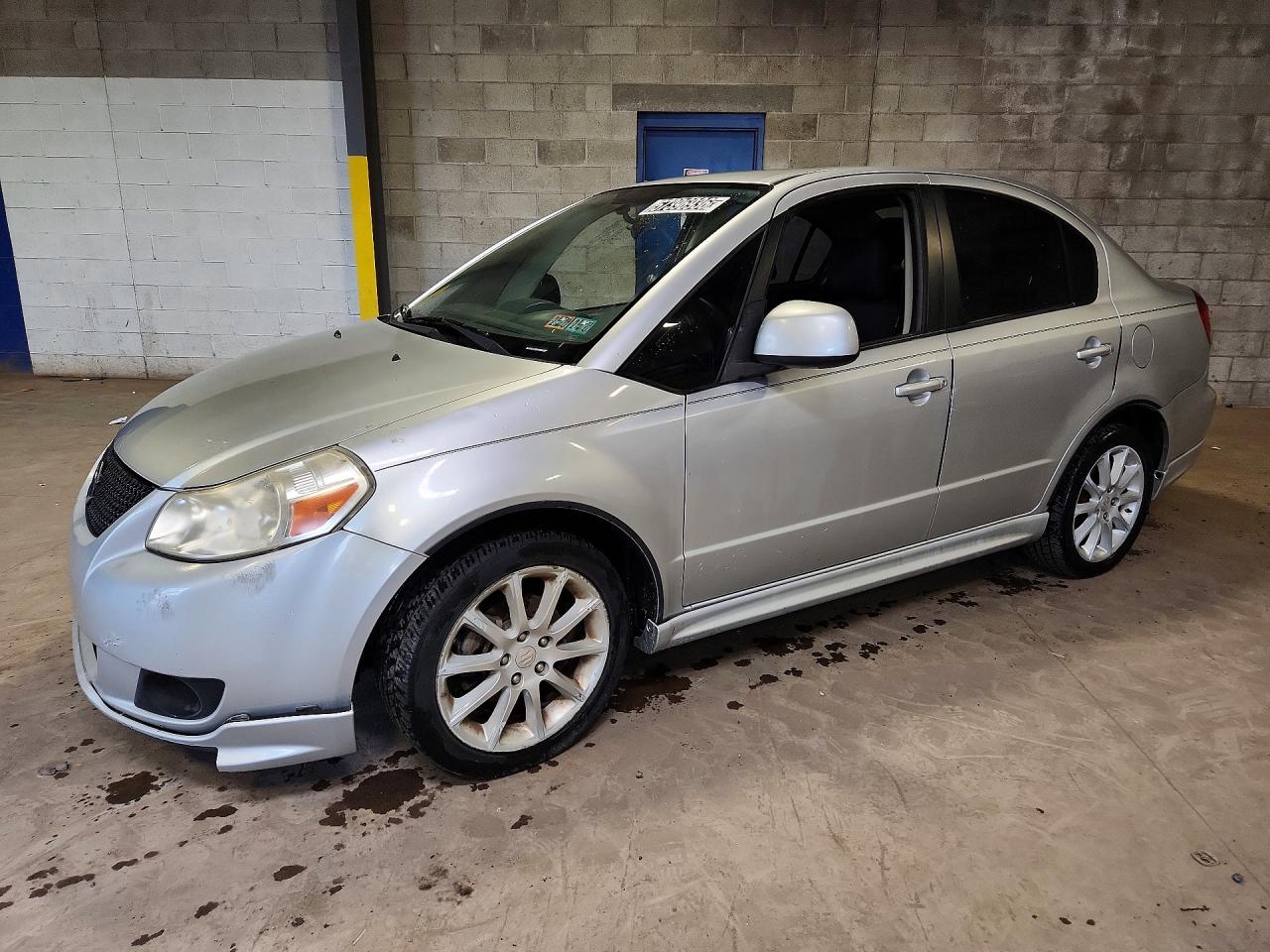 2011 Suzuki SX4 Sport S, VIN JS2YC5A42B6300458 — Normal wear