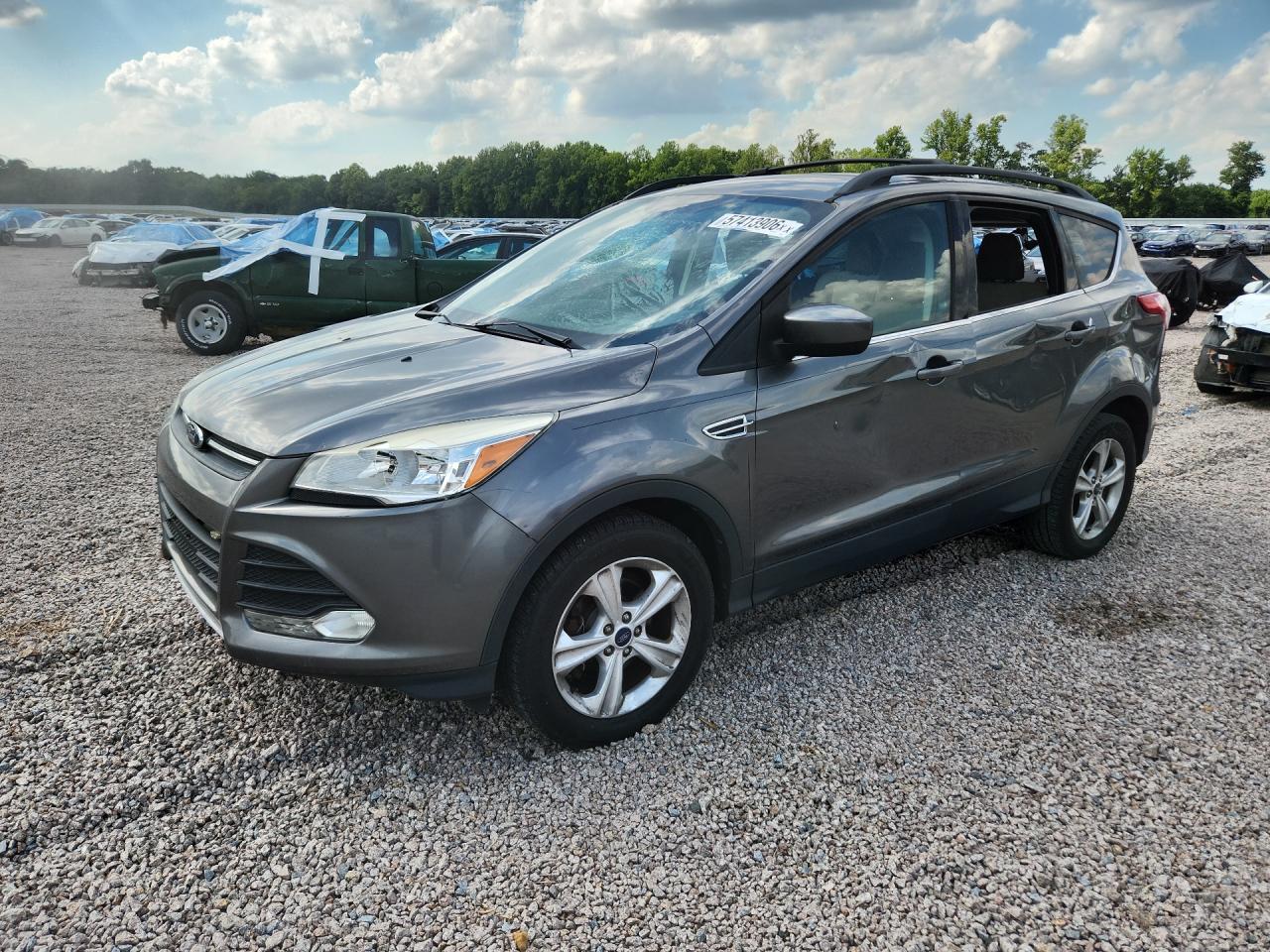2014 Ford Escape SE, VIN 1FMCU0GX3EUD07128 — Vandalism