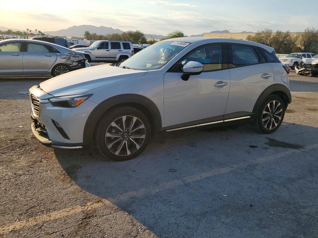 2019 Mazda CX-3 Grand Touring, VIN JM1DKFD76K1457723 — Side