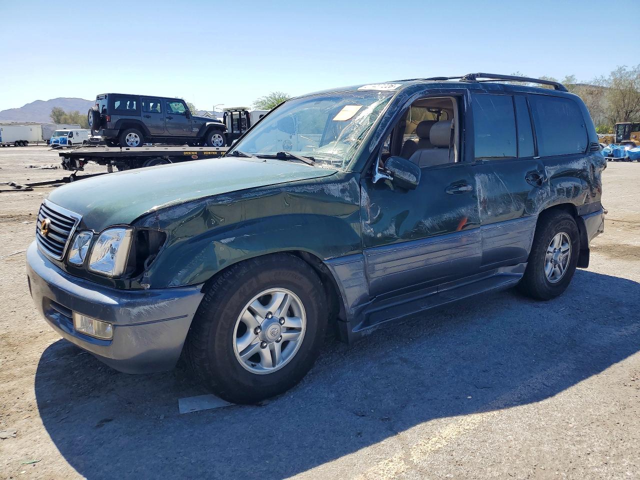2000 Lexus LX 470, VIN JT6HT00W3Y0106704 — Rollover