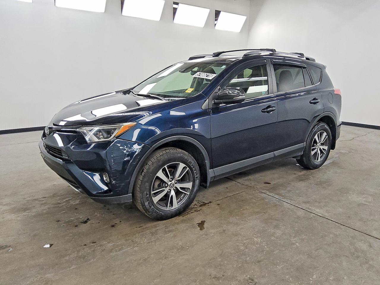 2018 Toyota RAV4 XLE, VIN JTMRFREV0JJ235458 — Front end