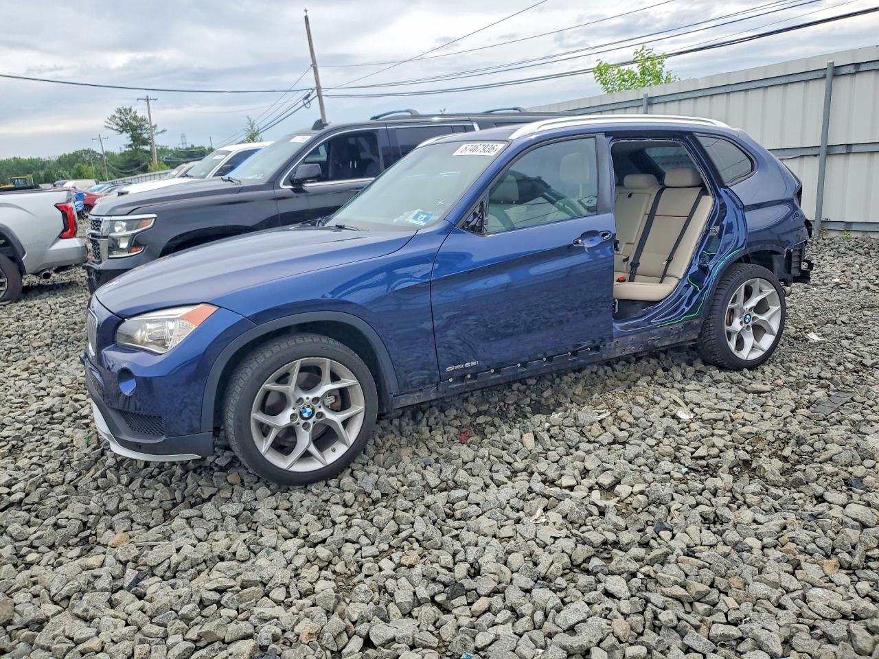 2015 BMW X1 sDrive28i, VIN WBAVM1C53FV316802 — Rear end