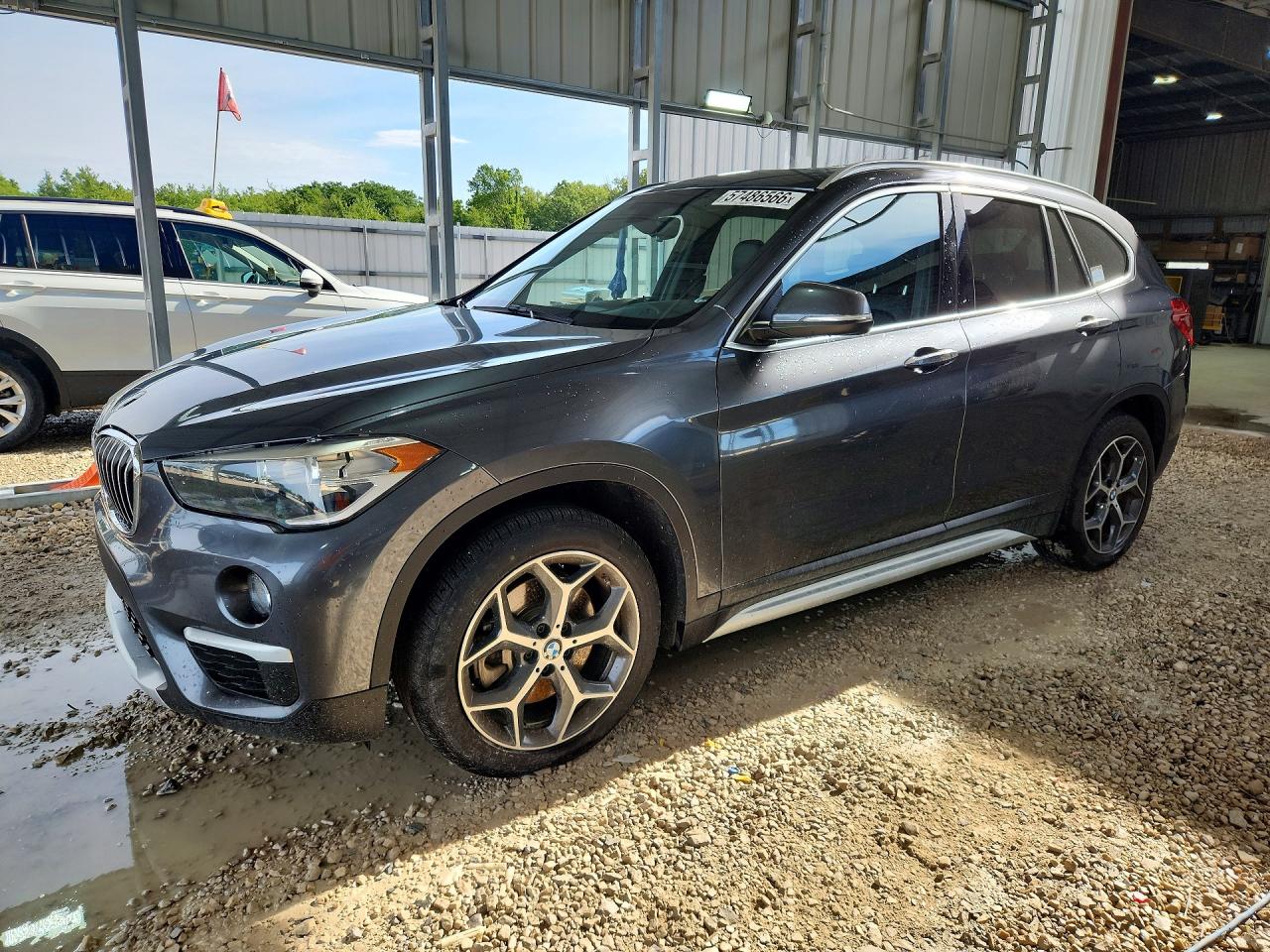 2018 BMW X1 sDrive28i, VIN WBXHU7C37J3H42648 — Water / flood