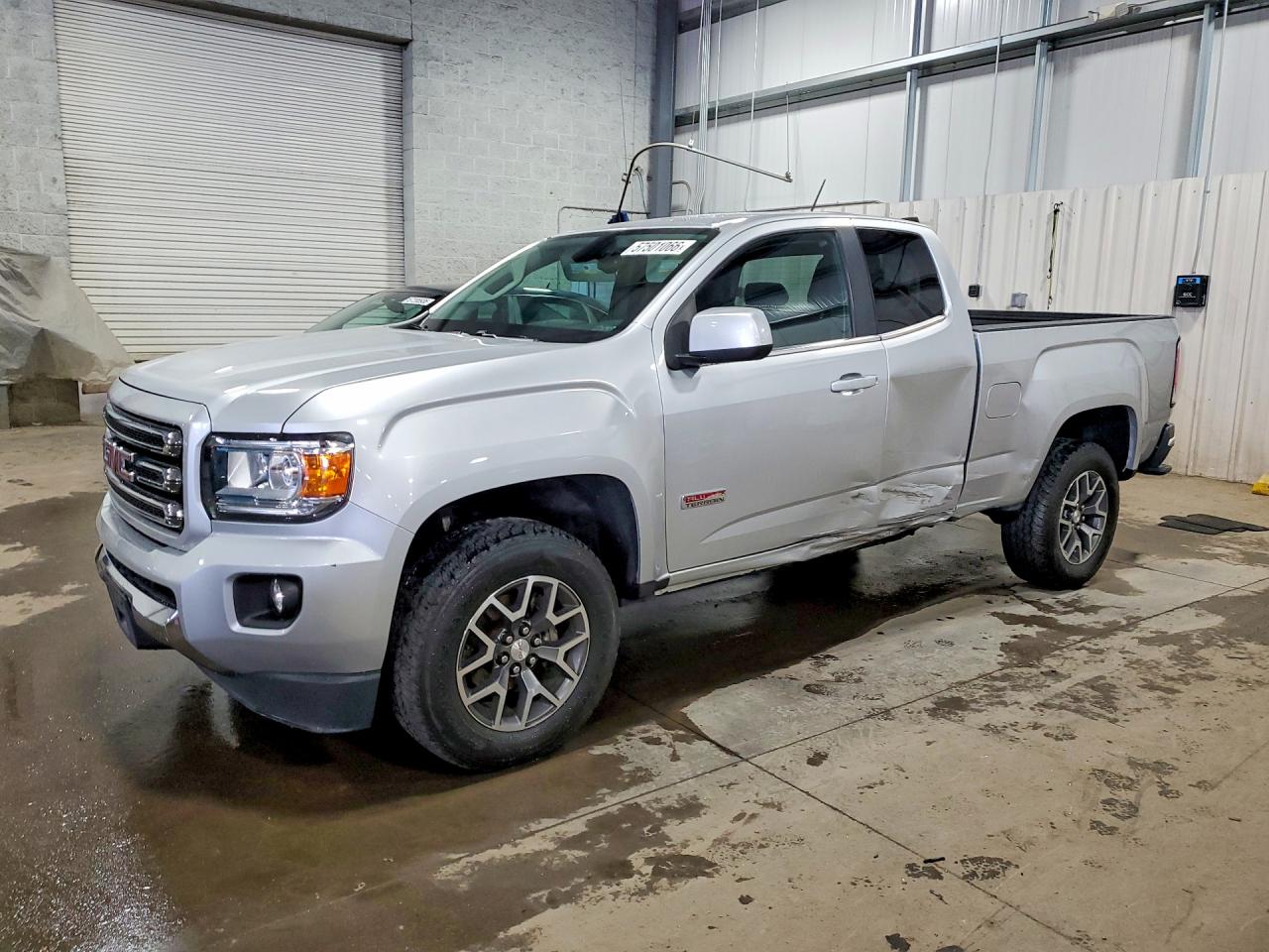 2015 GMC Canyon 4WD SLE, VIN 1GTH6BE38F1215385 — Side