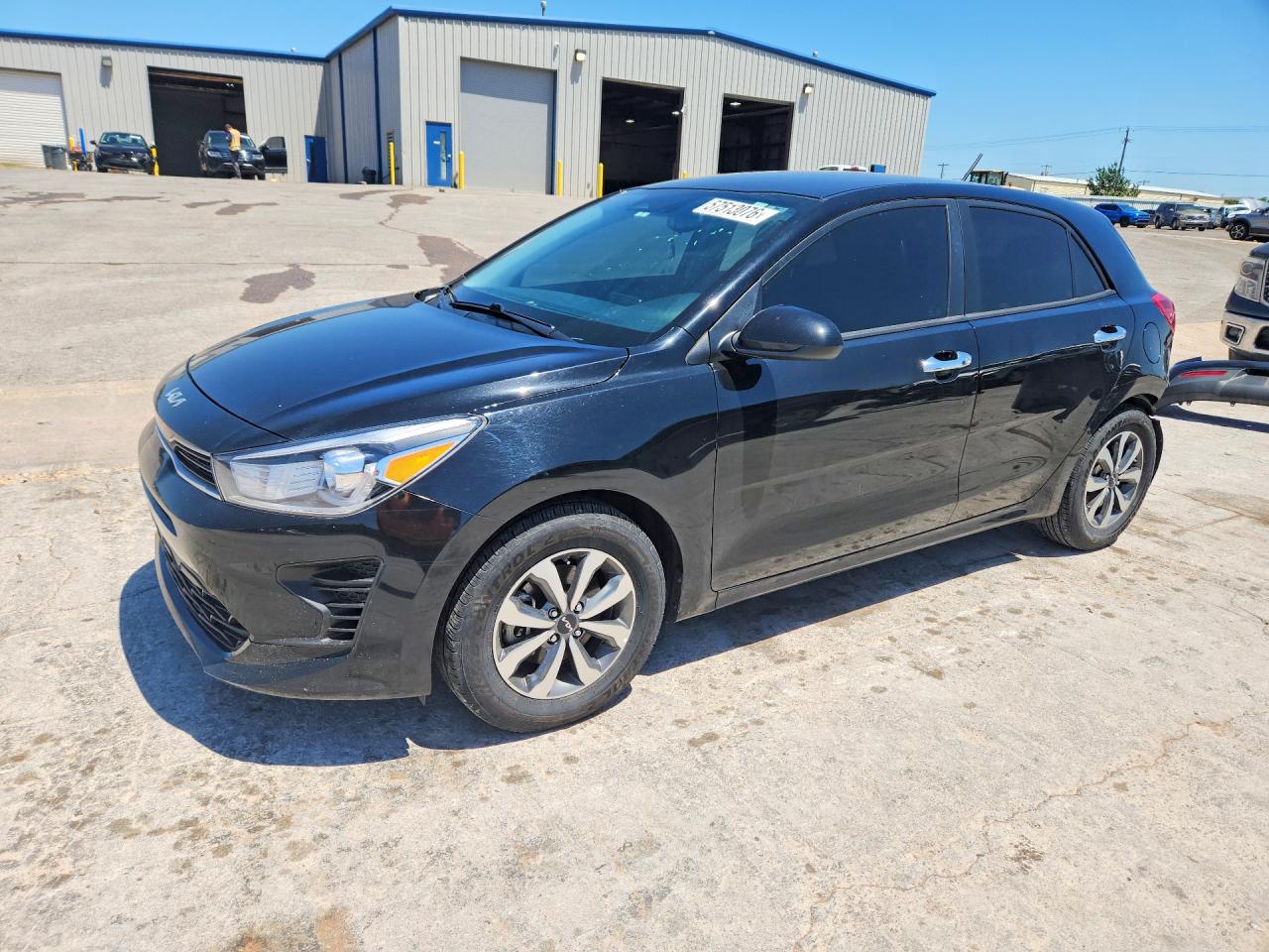 2023 Kia Rio S, VIN 3KPA25AD1PE594564 — Rear end
