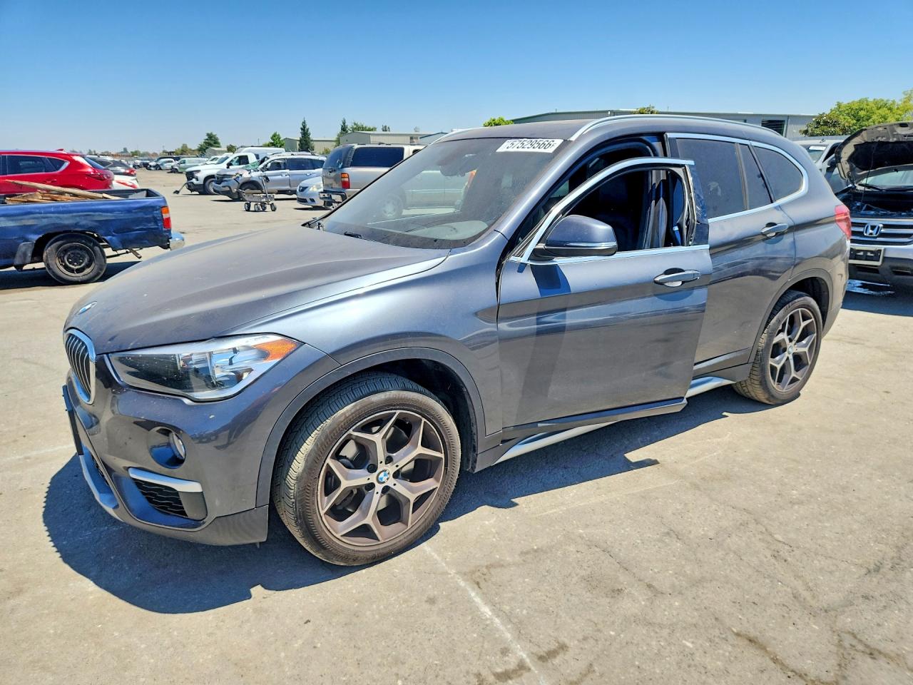 2018 BMW X1 sDrive28i, VIN WBXHU7C39J3H43459 — Side