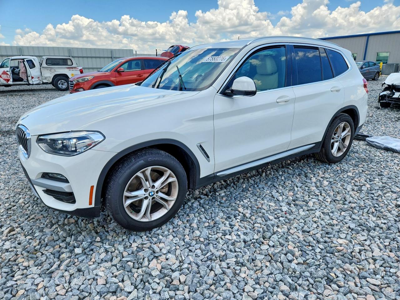 2021 BMW X3 xDrive30i, VIN 5UXTY5C00M9G26357 — Side