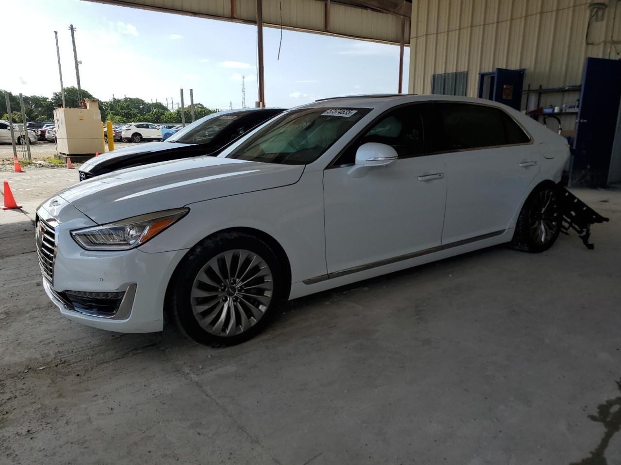 2019 Genesis G90 Premium, VIN KMTF34JA1KU058602 — Side