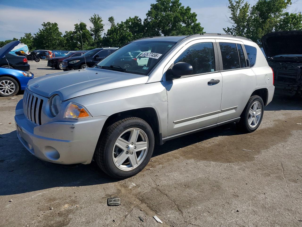 2009 Jeep Compass Sport, VIN 1J4FT47A19D139593 — Minor dents and scratches
