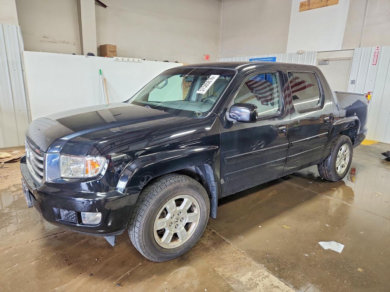 2012 Honda Ridgeline RTS, VIN 5FPYK1F4XCB457019 — Rear end