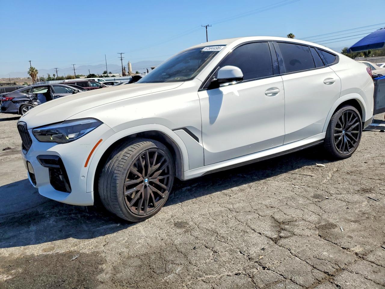 2022 BMW X6 xDrive40i, VIN 5UXCY6C07N9K62314 — Side