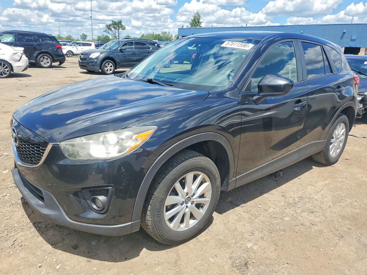 2013 Mazda CX-5 Touring, VIN JM3KE2CE5D0160014 — Side