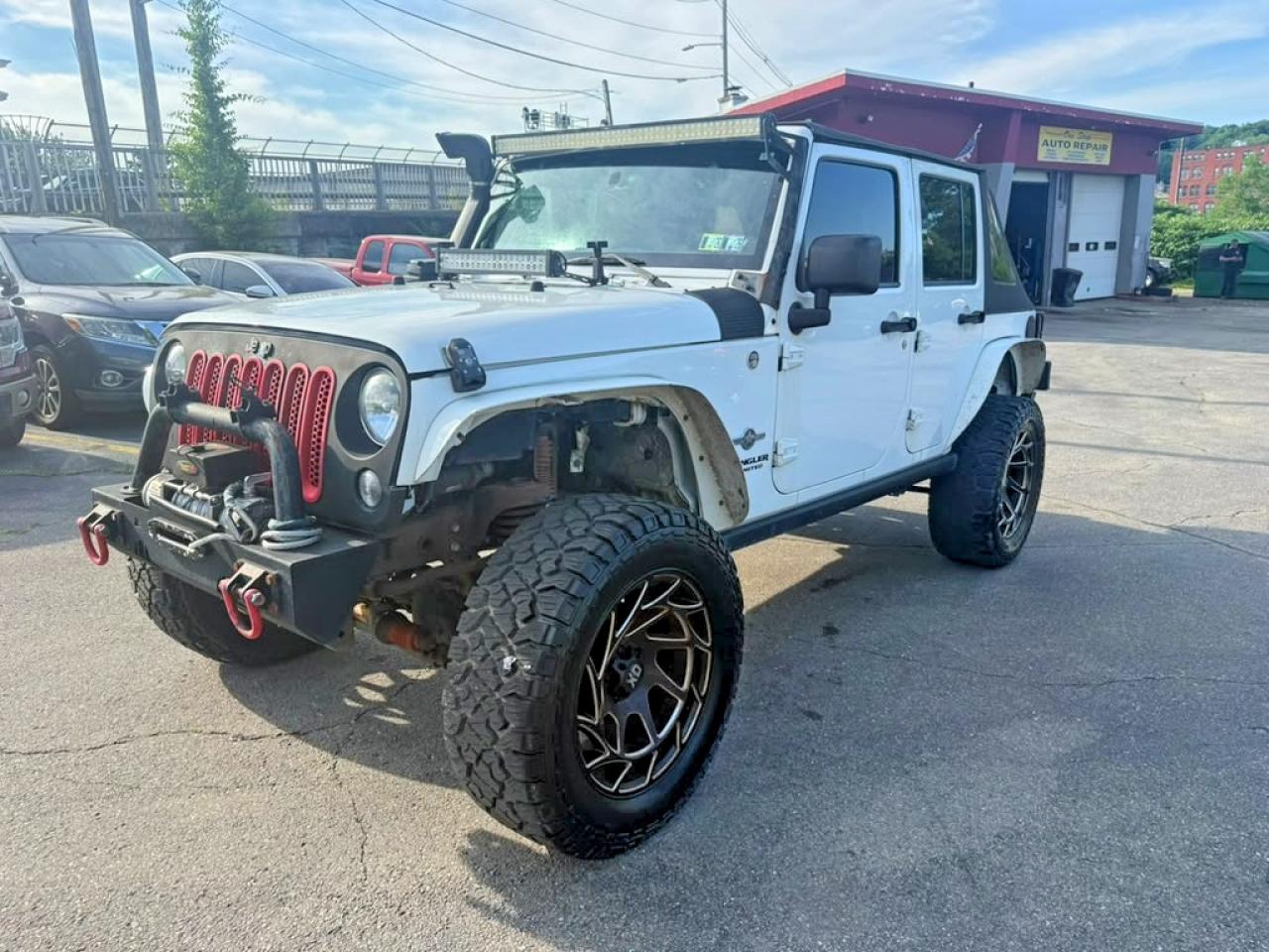 2014 Jeep Wrangler Unlimited Sport, VIN 1C4BJWDG7EL203909 — Minor dents and scratches