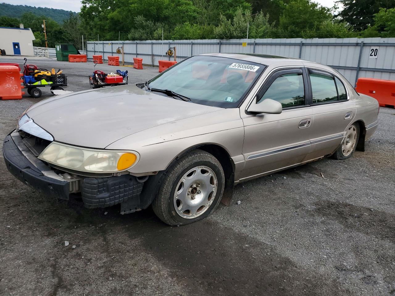 1999 Lincoln Continental, VIN 1LNHM97V3XY715827 — Side