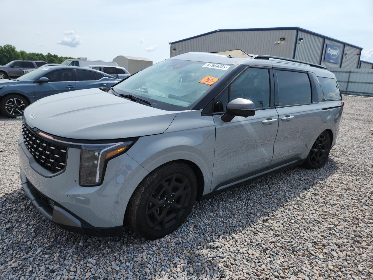 2025 Kia Carnival SX Prestige, VIN KNDNE5K30S6463459 — Бок