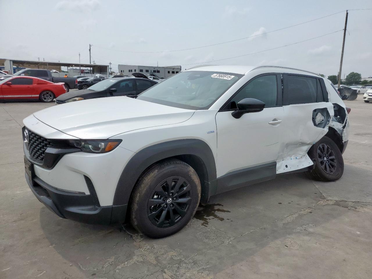 2025 Mazda CX-50 Hybrid Preferred Package, VIN 7MMVAABW2SN106093 — Side