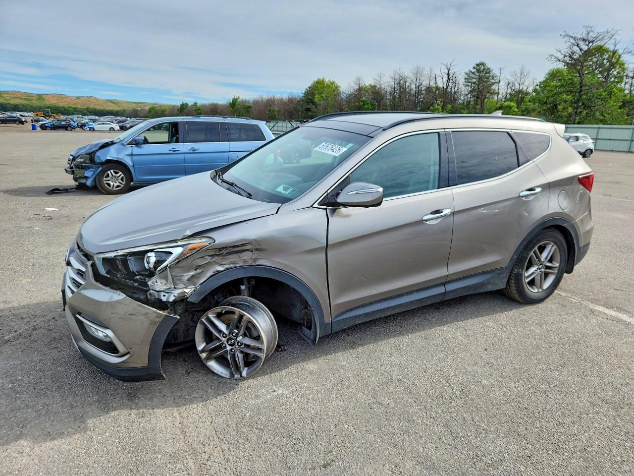 2017 Hyundai Santa Fe 2.4L, VIN 5XYZUDLBXHG424131 — Front end
