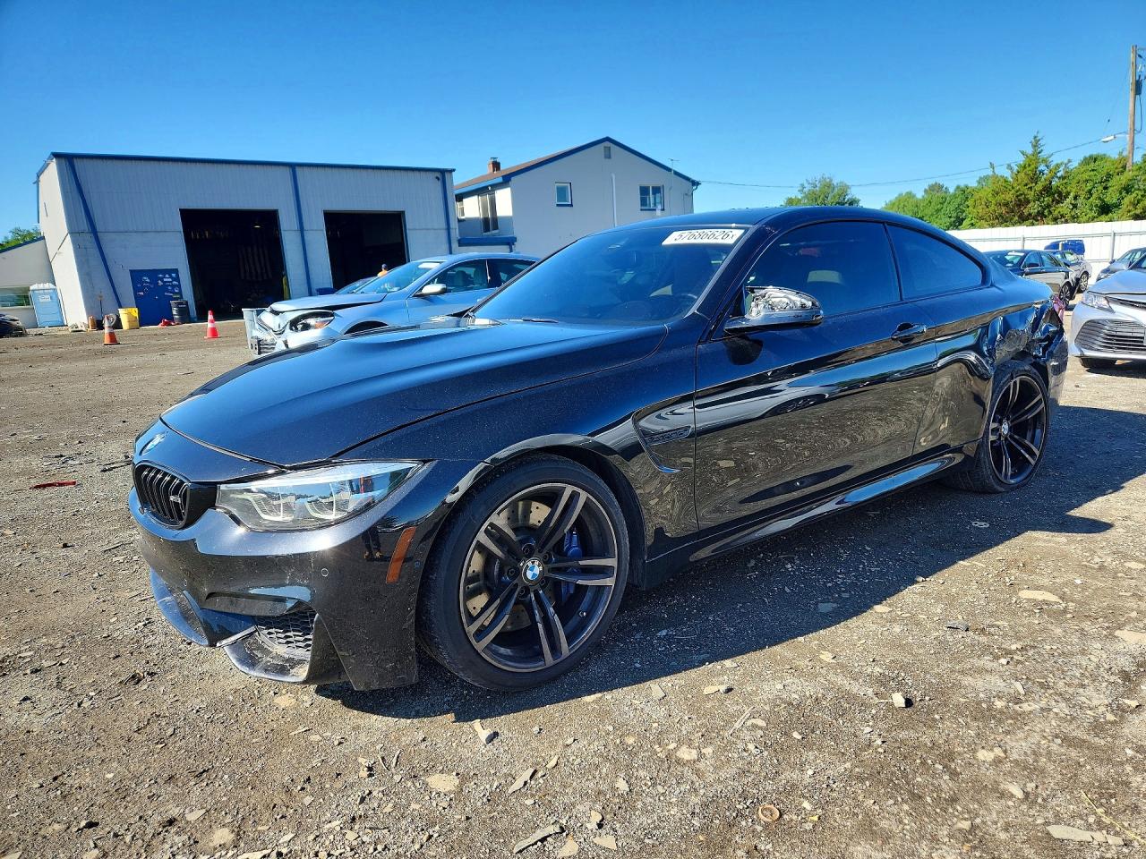 2018 BMW M4, VIN WBS4Y9C58JAC87620 — Side