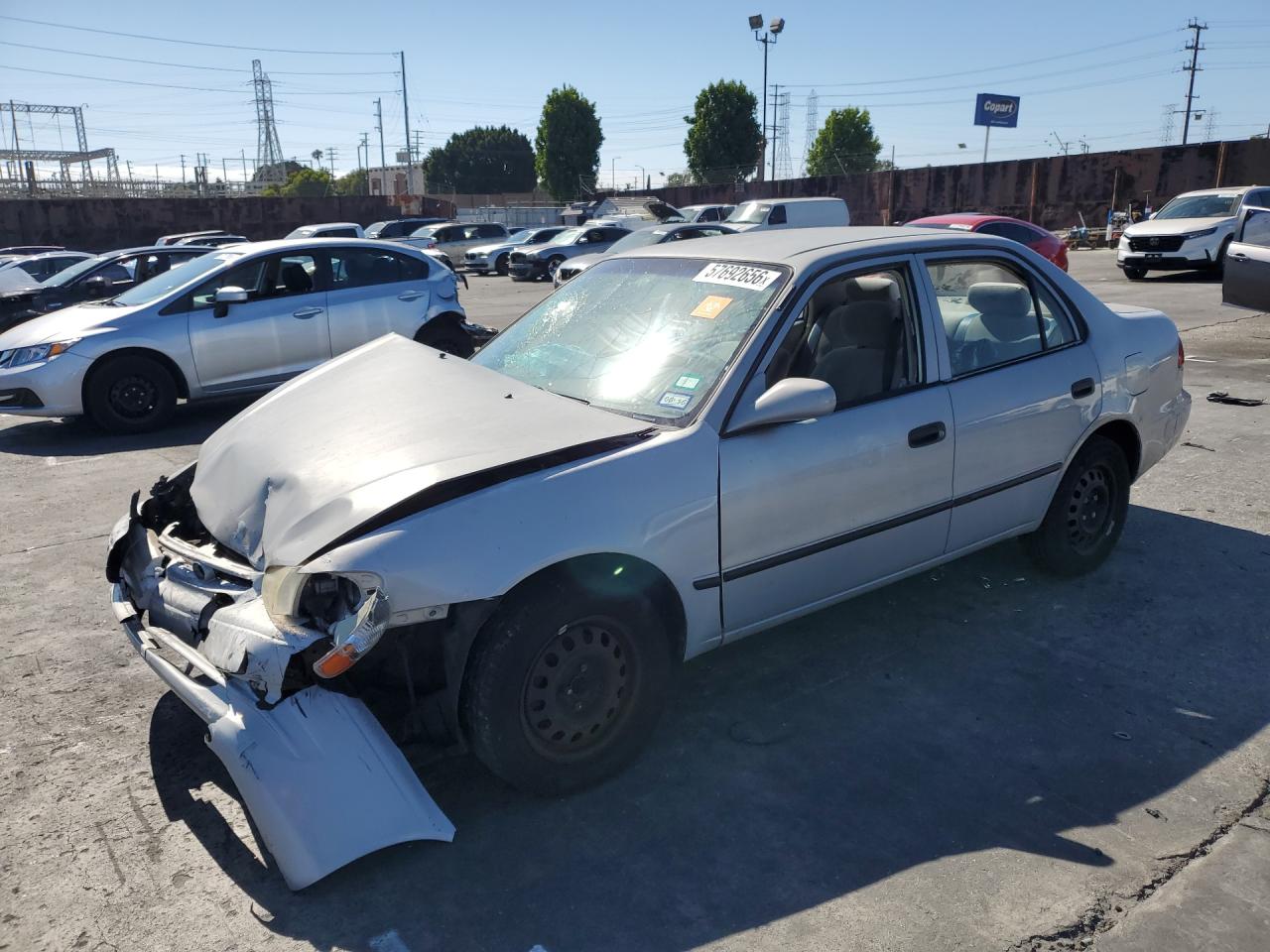 1999 Toyota Corolla CE, VIN 1NXBR12E3XZ227498 — Front end