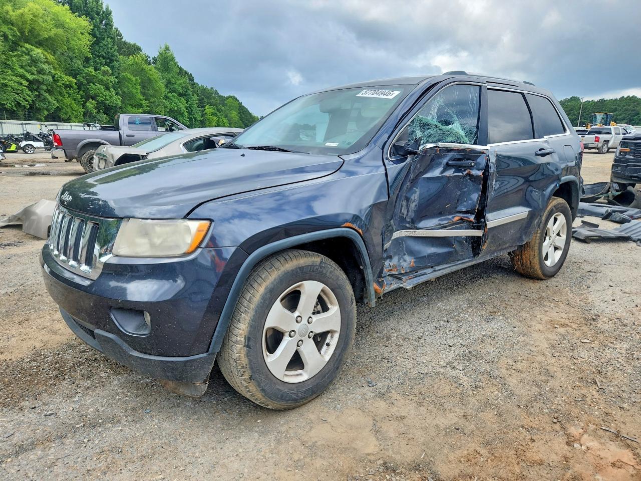 2013 Jeep Grand Cherokee Laredo, VIN 1C4RJEAG9DC650785 — Side