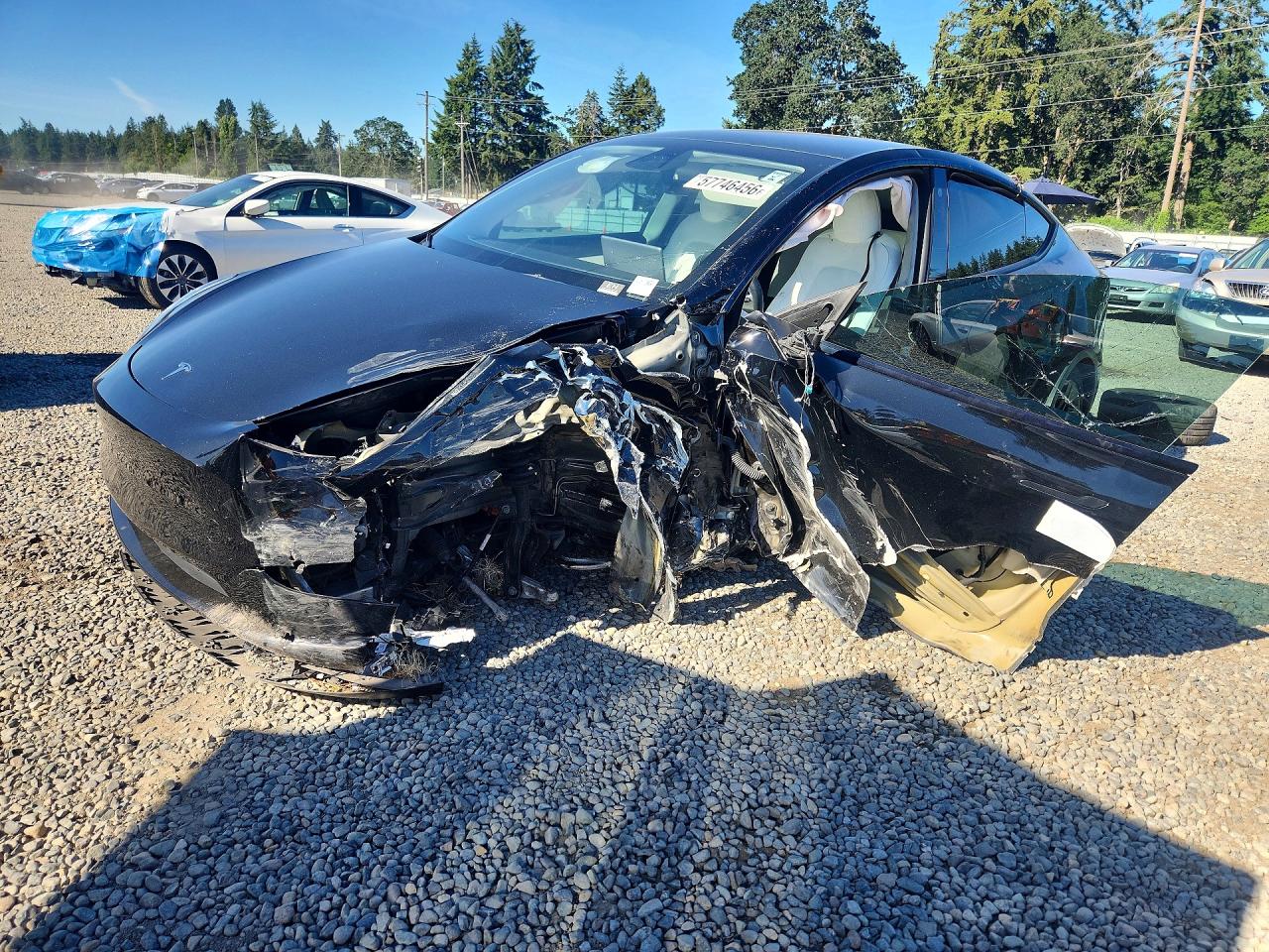 2022 Tesla Model Y Long Range, VIN 7SAYGAEE7NF427079 — Front end