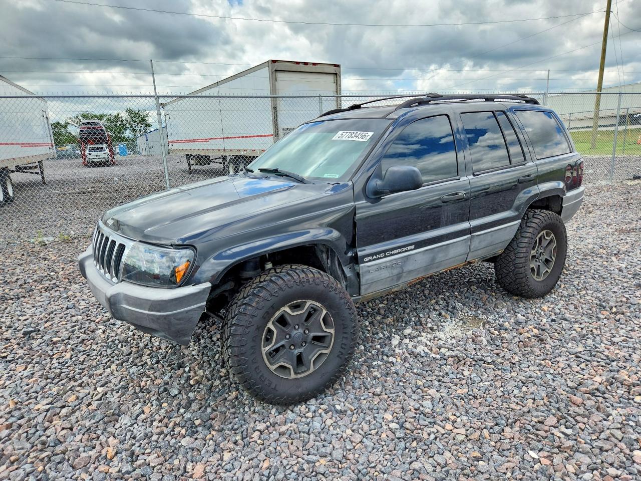 1999 Jeep Grand Cherokee Laredo, VIN 1J4GW58S6XC587386 — Side