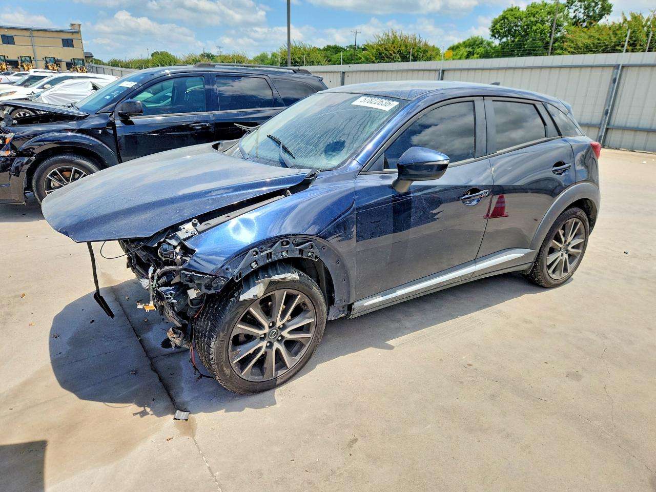 2016 Mazda CX-3 Grand Touring, VIN JM1DKBD70G0120793 — Front end