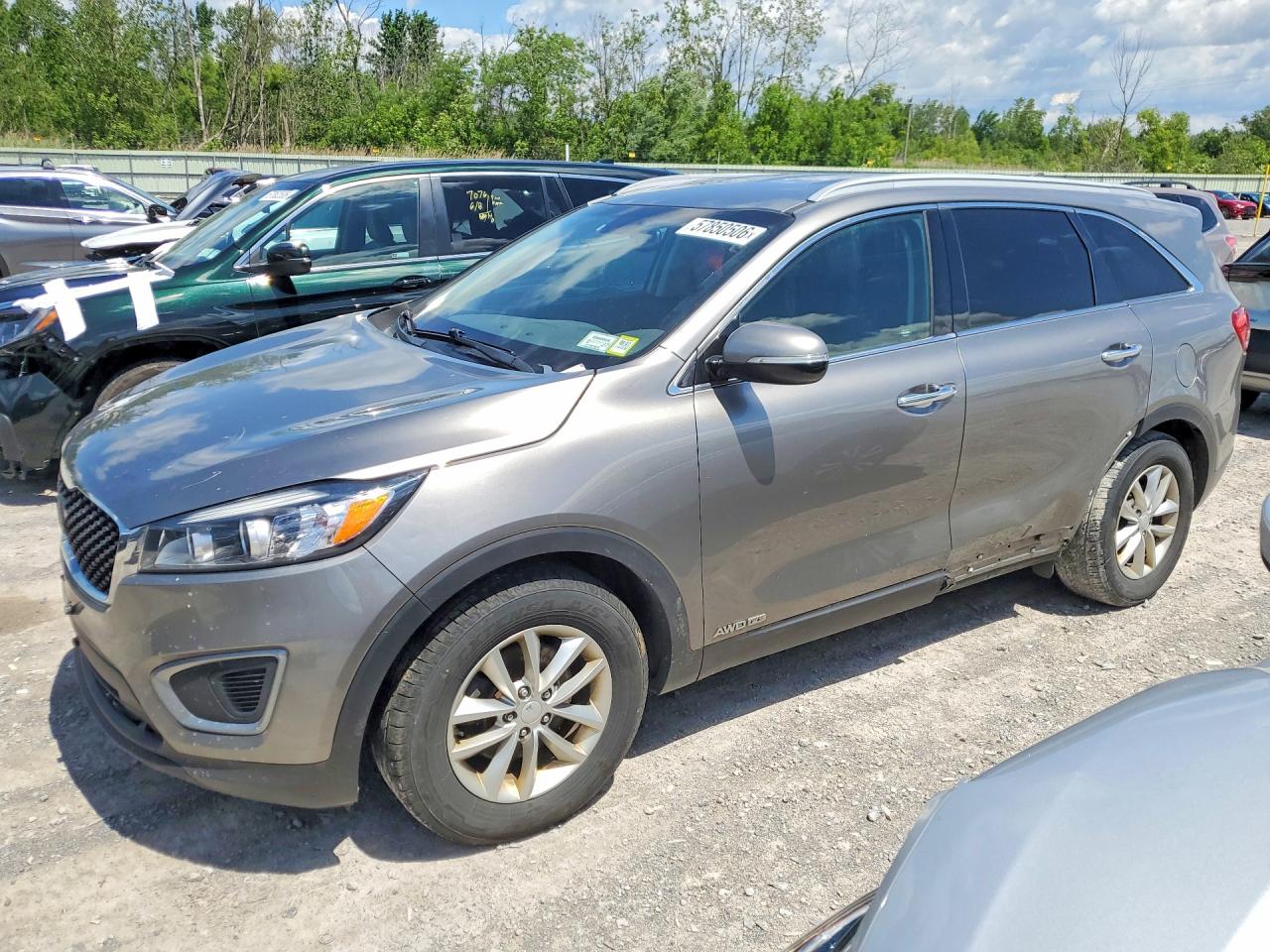 2016 Kia Sorento LX, VIN 5XYPGDA52GG183644 — Side