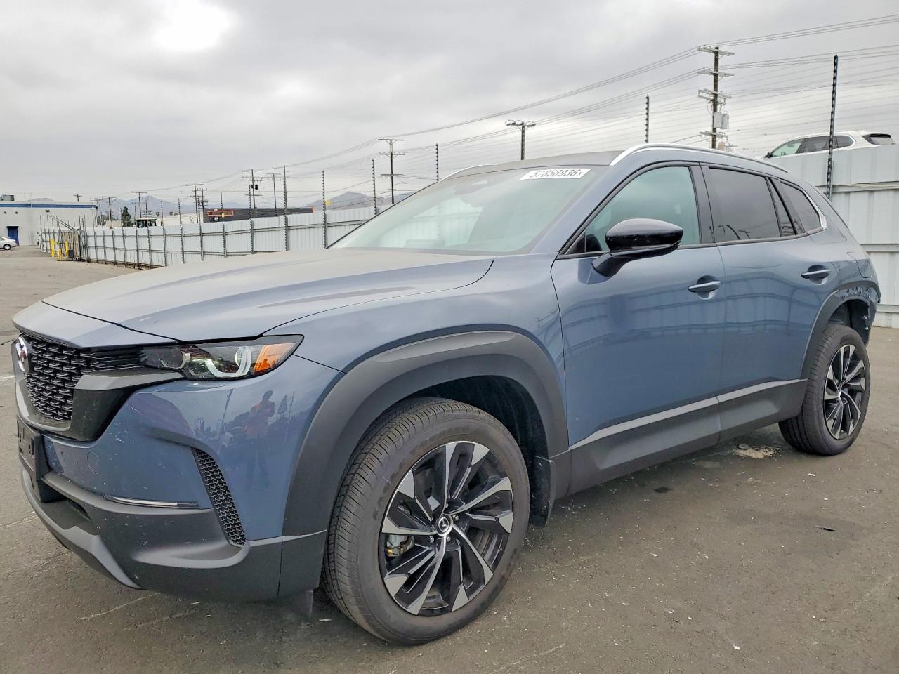 2026 Mazda CX-50 Hybrid Premium Plus, VIN 7MMVAAEW7TN146991 — Rear end