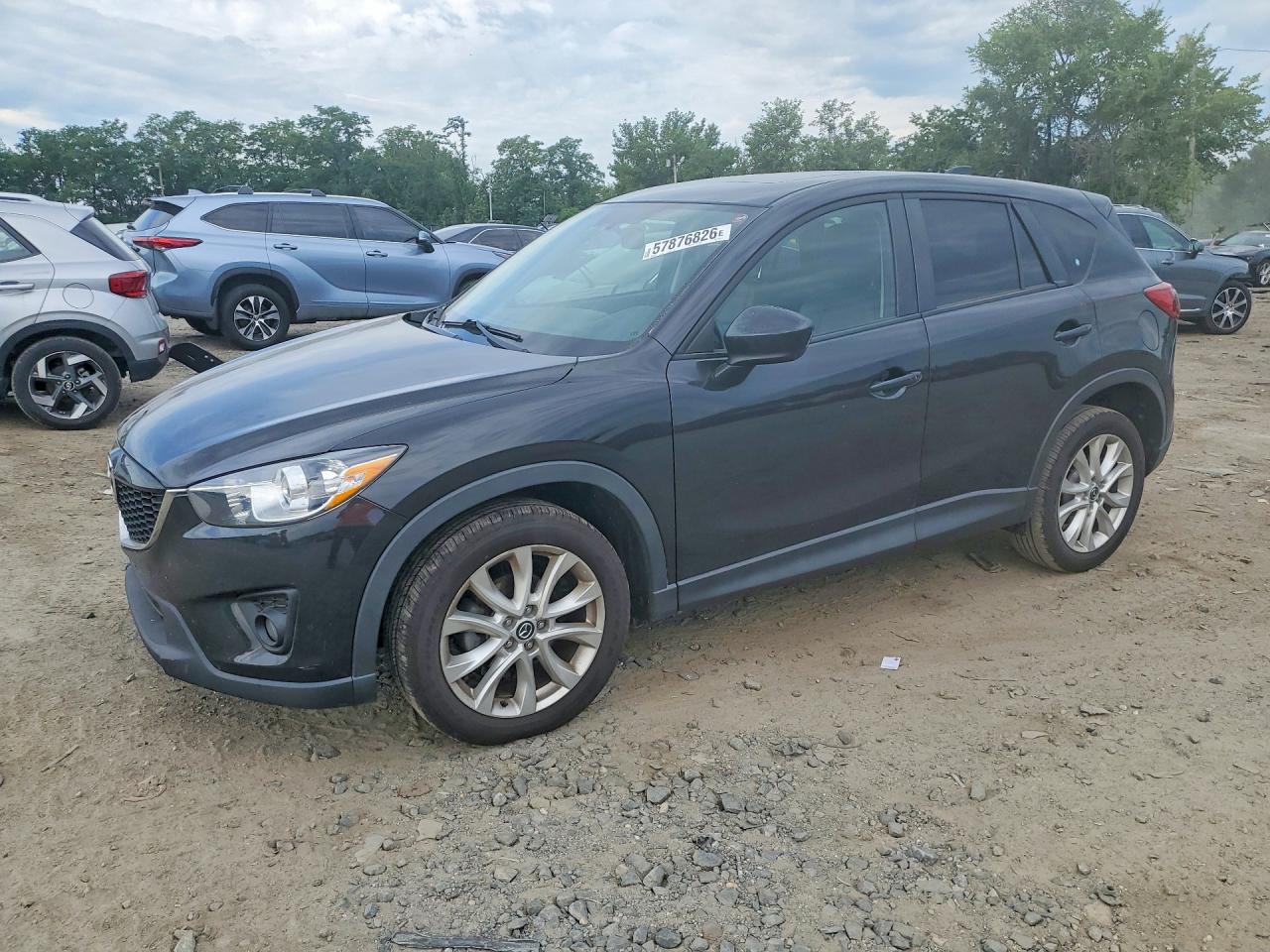 2013 Mazda CX-5 Grand Touring, VIN JM3KE2DE6D0167116 — Side