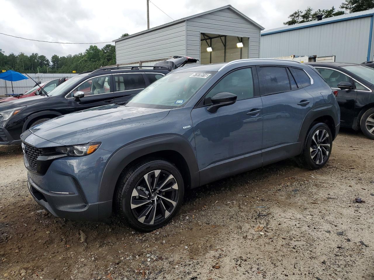 2025 Mazda CX-50 Hybrid Premium Plus Package, VIN 7MMVAAEW9SN139457 — Side