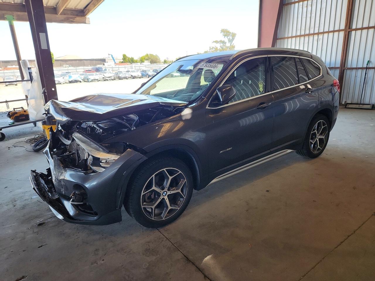 2018 BMW X1 xDrive28i, VIN WBXHT3C37J5F91908 — Front end
