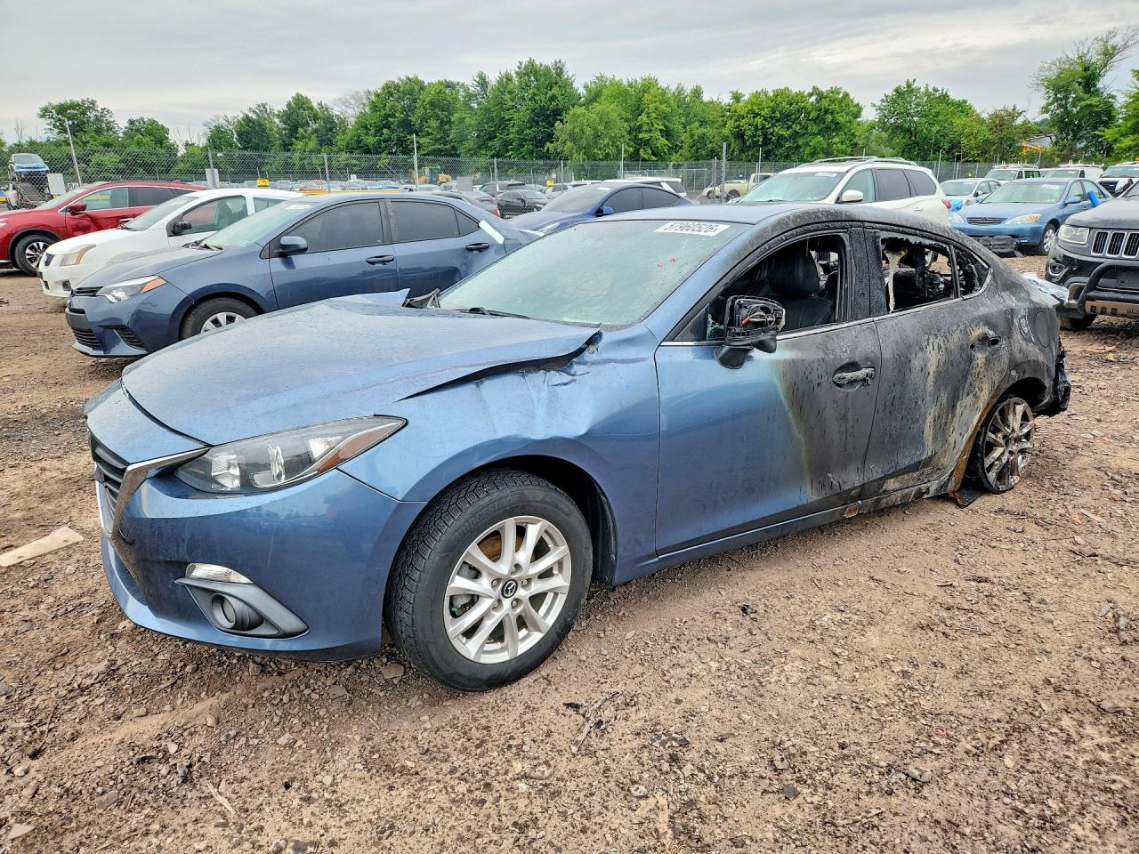 2015 Mazda 3 i Grand Touring, VIN 3MZBM1W7XFM201057 — Burn