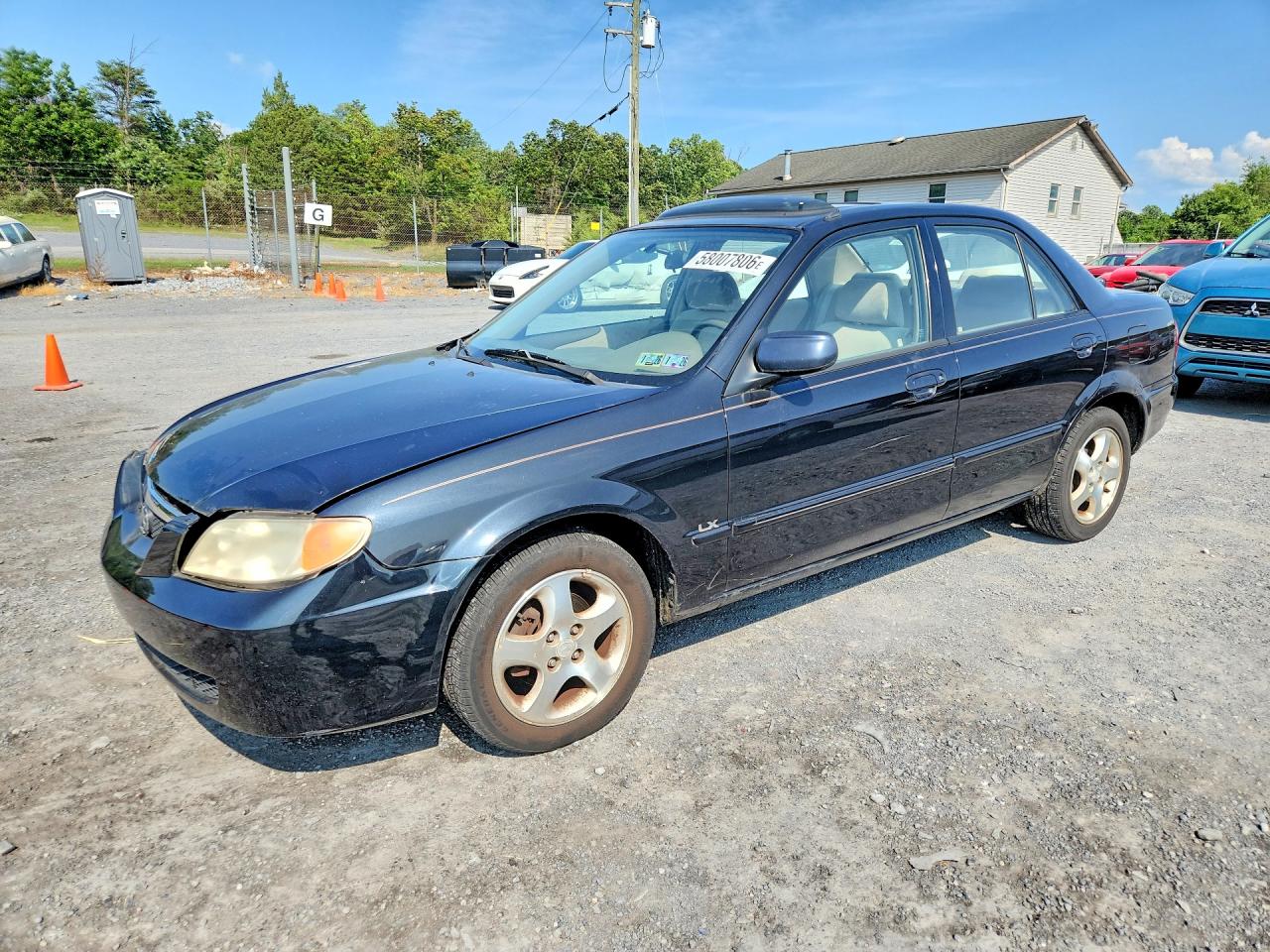 2002 Mazda Protege DX, VIN JM1BJ226X21555098 — Front end