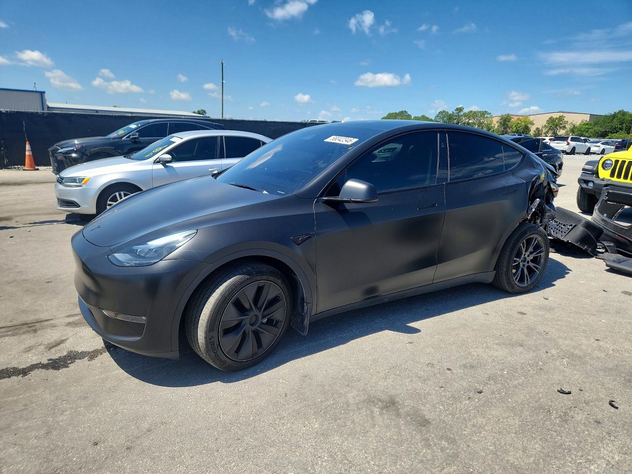 2024 Tesla Model Y Long Range, VIN 7SAYGAEE2RF186506 — Rear end