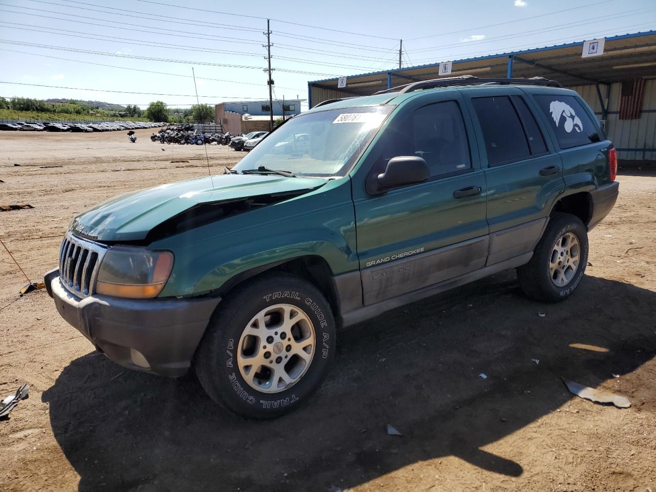 1999 Jeep Grand Cherokee Laredo, VIN 1J4GW58S7XC568362 — Side