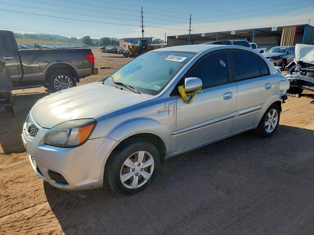 2011 Kia Rio LX, VIN KNADH4A33B6734798 — Зад