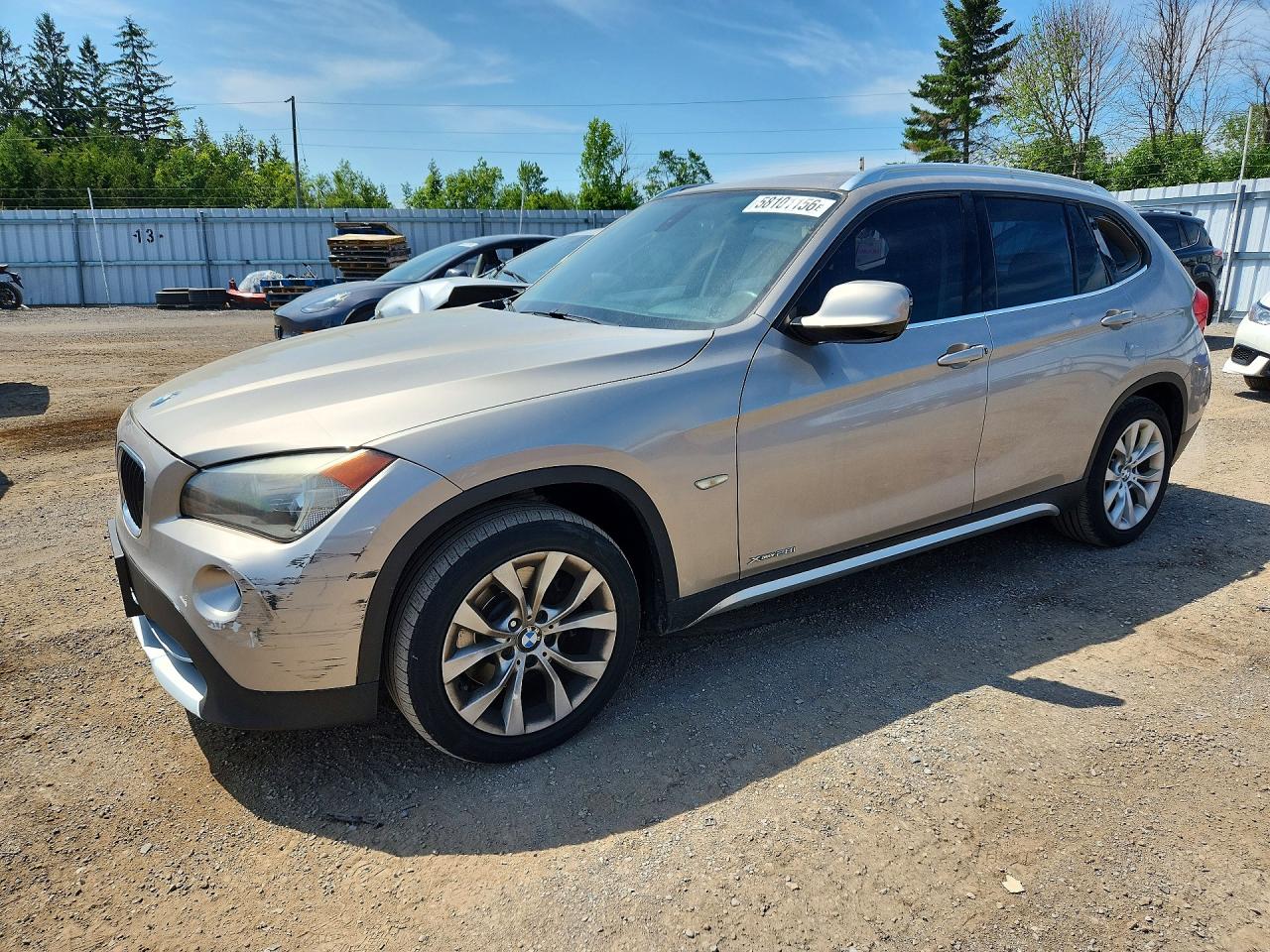 2012 BMW X1 28i, VIN WBAVL1C50CVR79310 — Бок