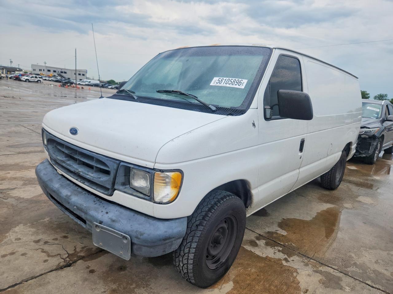 1998 Ford Econoline Cargo, VIN 1FTRE1429WHC18085 — Side