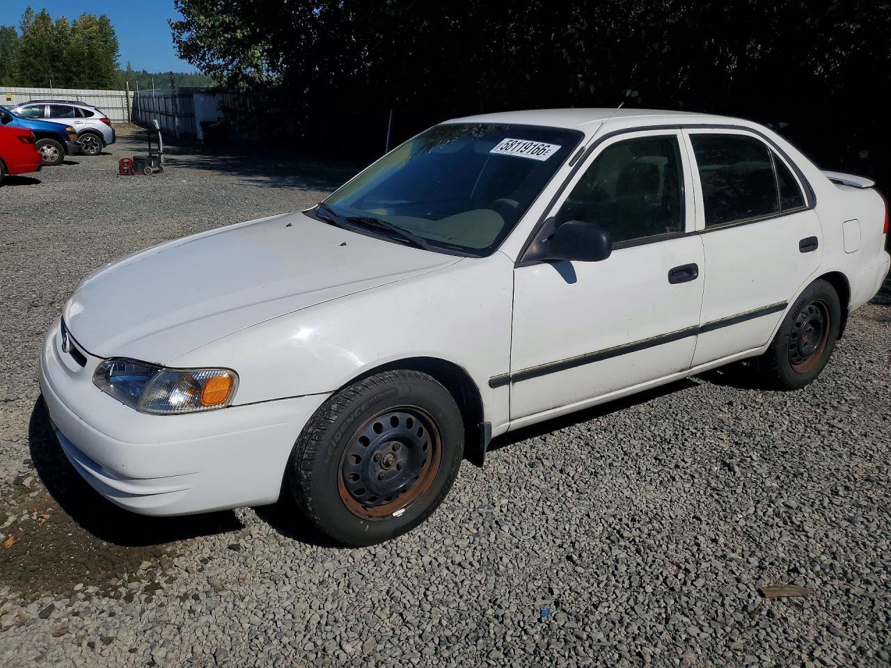 2000 Toyota Corolla CE, VIN 1NXBR12E9YZ306711 — Minor dents and scratches