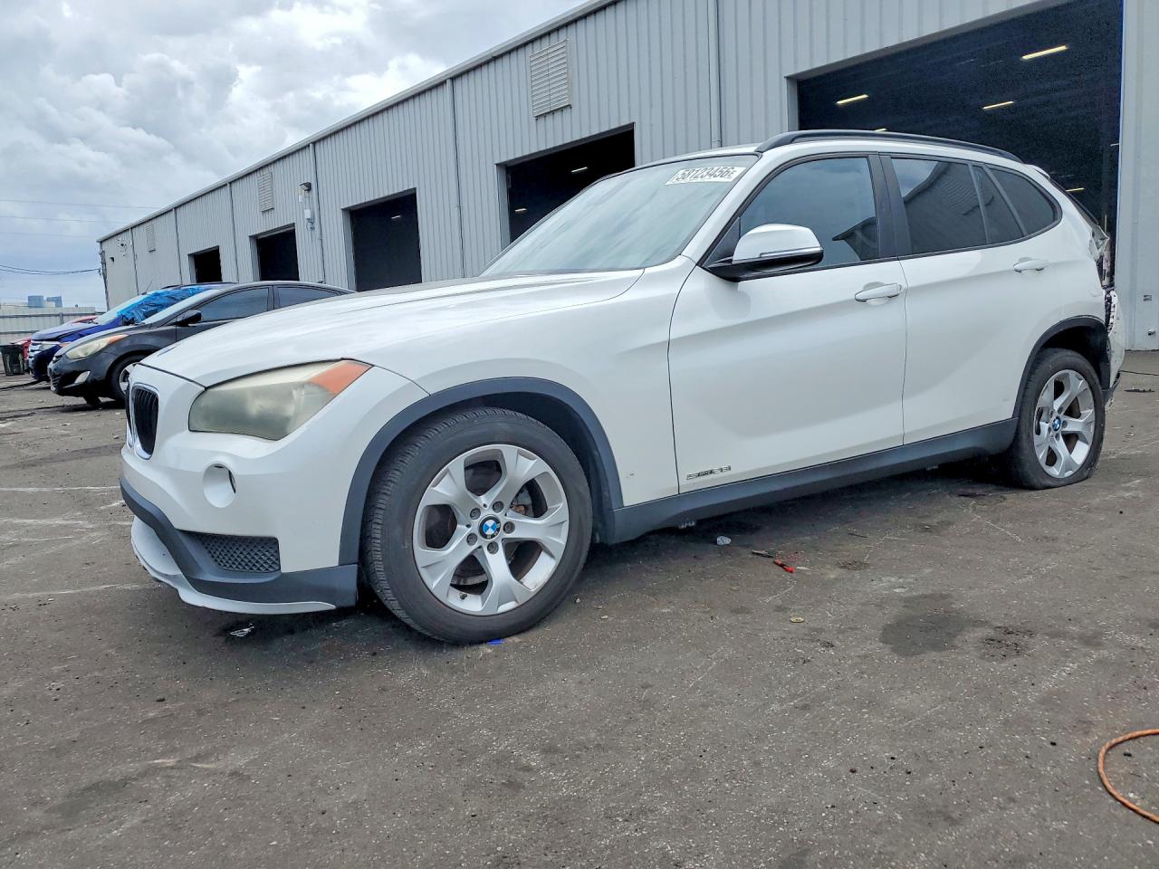 2015 BMW X1 sDrive28i, VIN WBAVM1C59FVZ94521 — Rear end