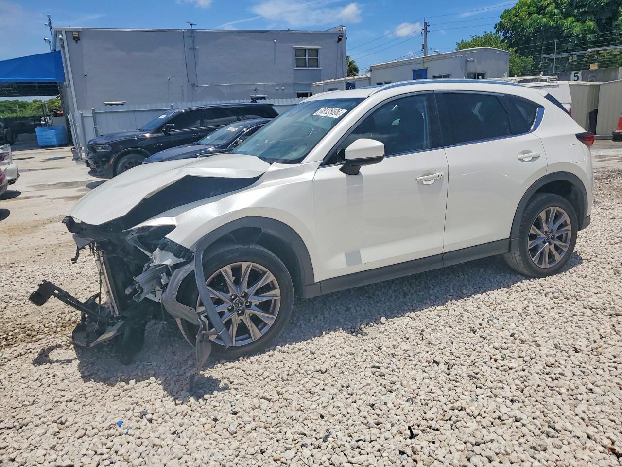 2021 Mazda CX-5 Grand Touring, VIN JM3KFADM4M0303273 — Front end