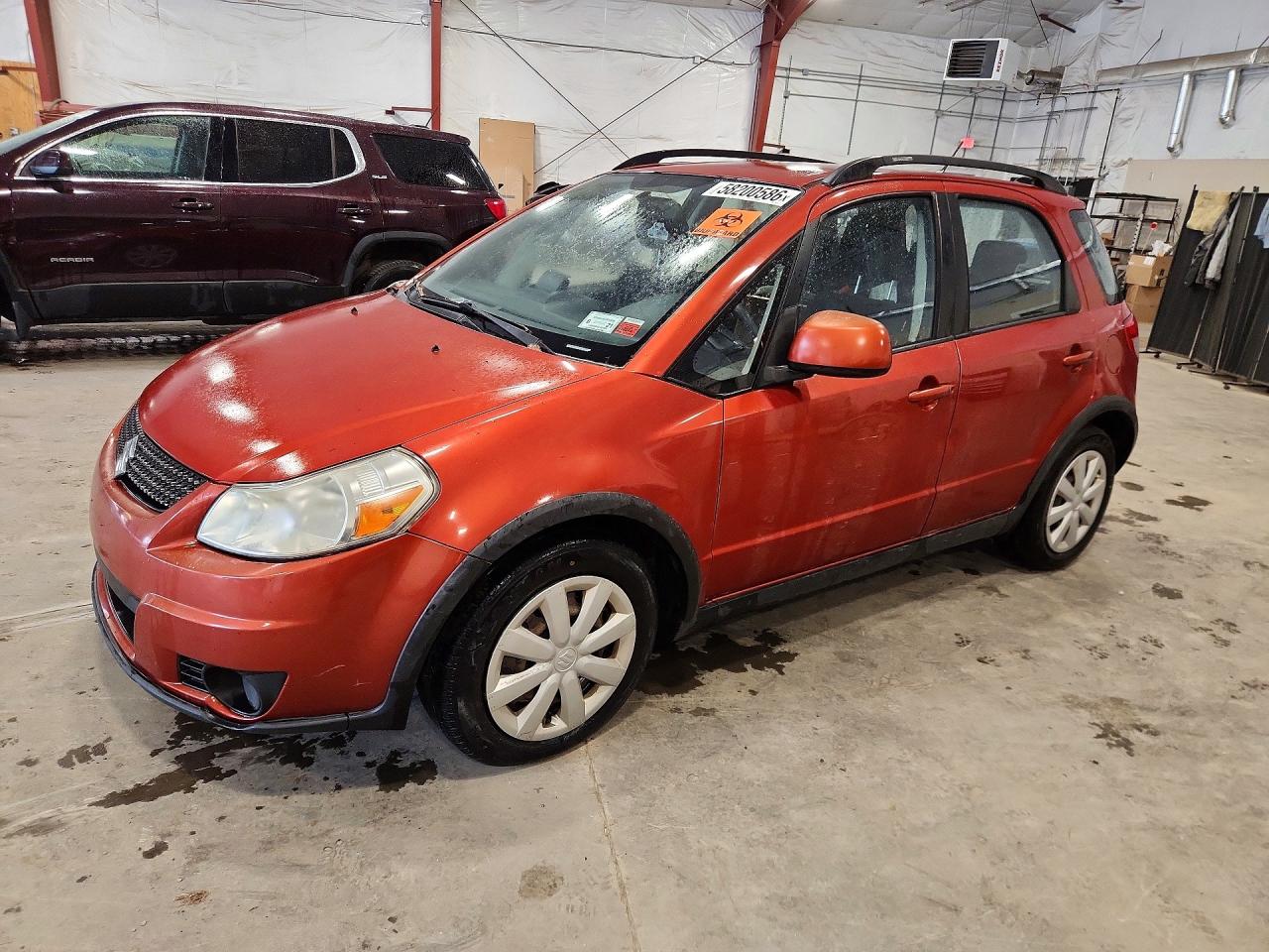 2010 Suzuki SX4, VIN JS2YB5A33A6300218 — Minor dents and scratches