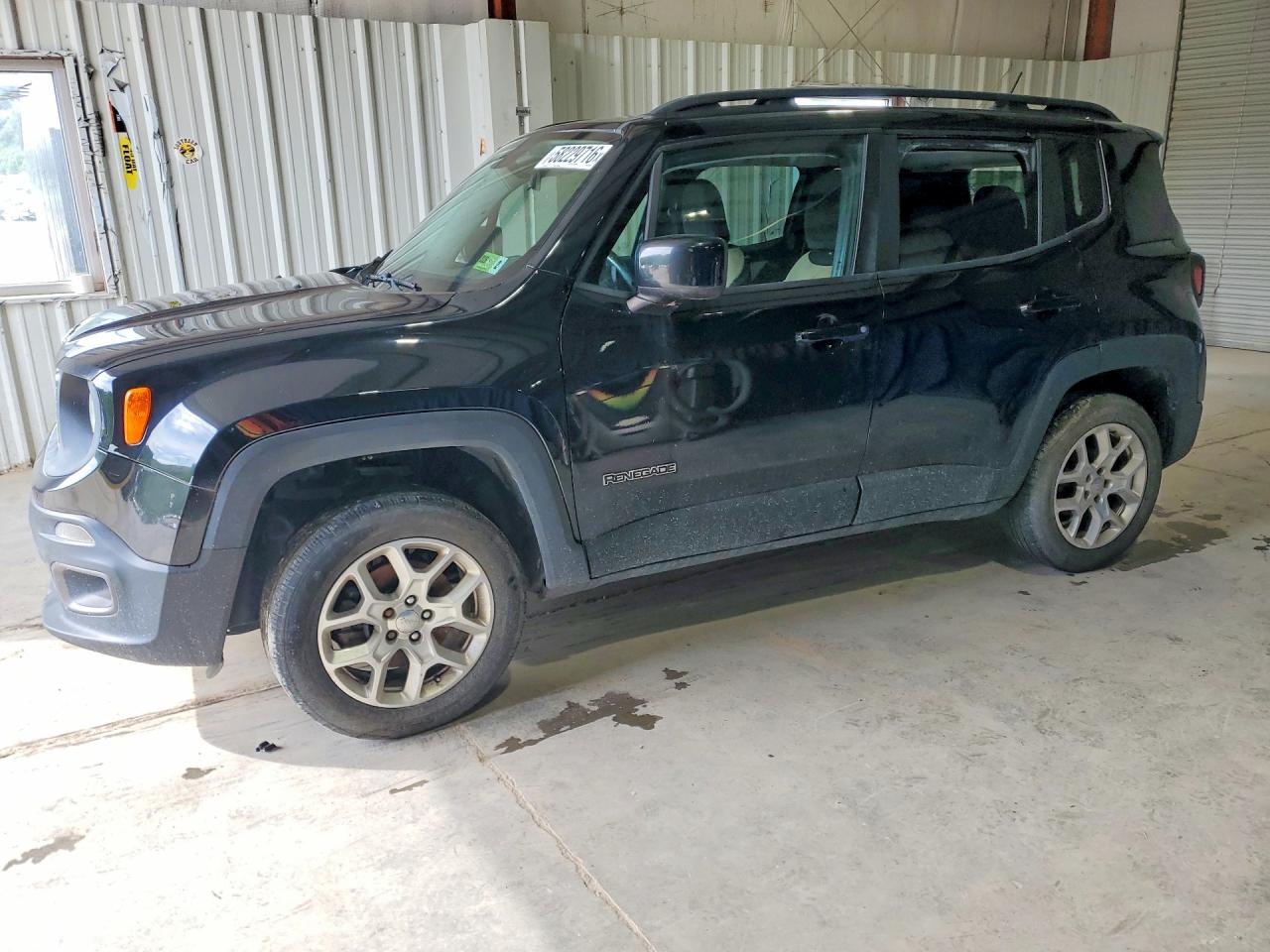 2015 Jeep Renegade Latitude, VIN ZACCJBBT0FPB59589 — Side